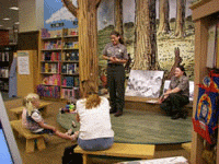 Park Rangers conduct a reading program. Park Rangers conduct a reading program.