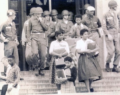 LR93.jpg Members of the Little Rock Nine walking down the steps of Little Rock Central High School, escorted by soldiers,