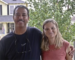 Keith Plessy and Phoebe Ferguson pose together smiling for the camera.