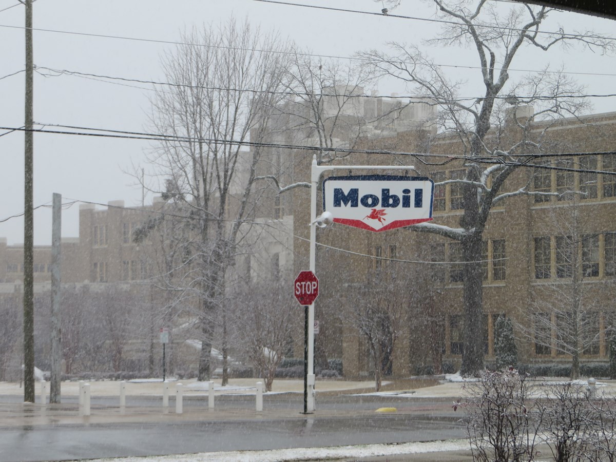 A Mobil sign hangs in front of the 1950s Magnolia Station within the NHS.