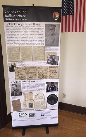 Roll up banner display and U.S. flag on wall Roll up banner display and U.S. flag on wall