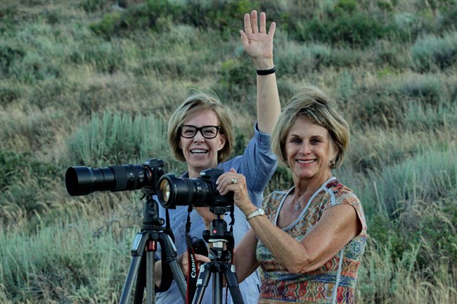 Photographers behind their camera in City of Rocks