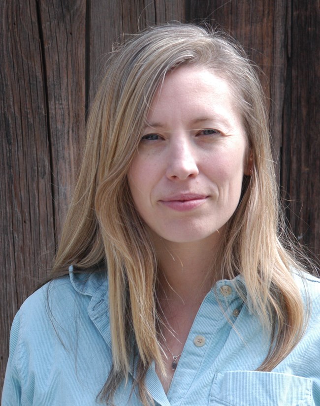 Portrait of a a Caucasian woman with blonde hair.