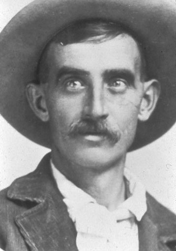 A black and white photograph of John Otto, wearing a hat.