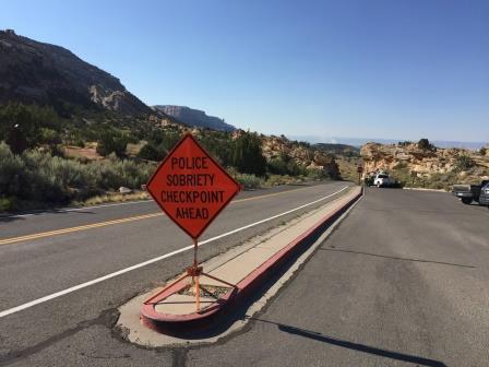 Checkpoint Sign along road with words Police Sobriety Checkpoint Ahead