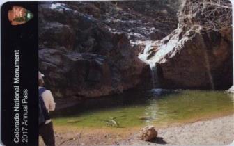 Photo on pass is of hiker observing waterfall and small pool. Photo on pass is of hiker observing waterfall and small pool.