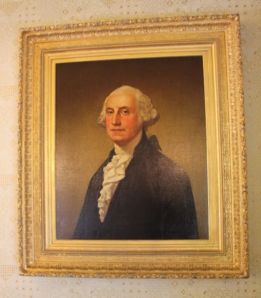 Artist Alonzo Pease from a painting by Gilbert Stuart Medium Oil on canvas Date 1881 Location Second floor hallway James A Garfield National Historic Site A painting of General George Washington. He is an older white gentleman with a powdered wig and stately nose.