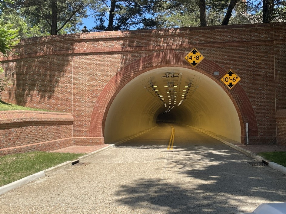 Brick faced entrance to a tunnel that goes under Williamsburg