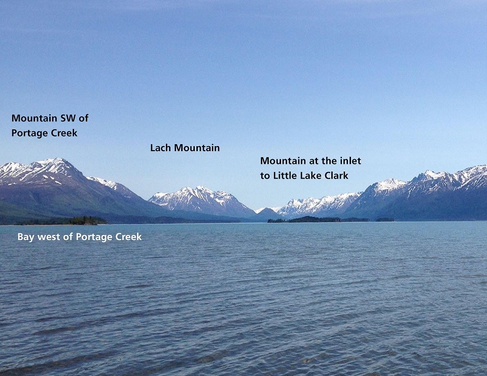 Image of lake, mountains background. "Tits'nadzeni (Mountain SW of Portage Creek)", "Tits'nadzeni Yit udghi'u (west Portage Creek)", "Nusdatl'na Dghil'u (Lach Mtn)", "Hkayinust'in (Mtn at inlet to Little Lake Clark)"