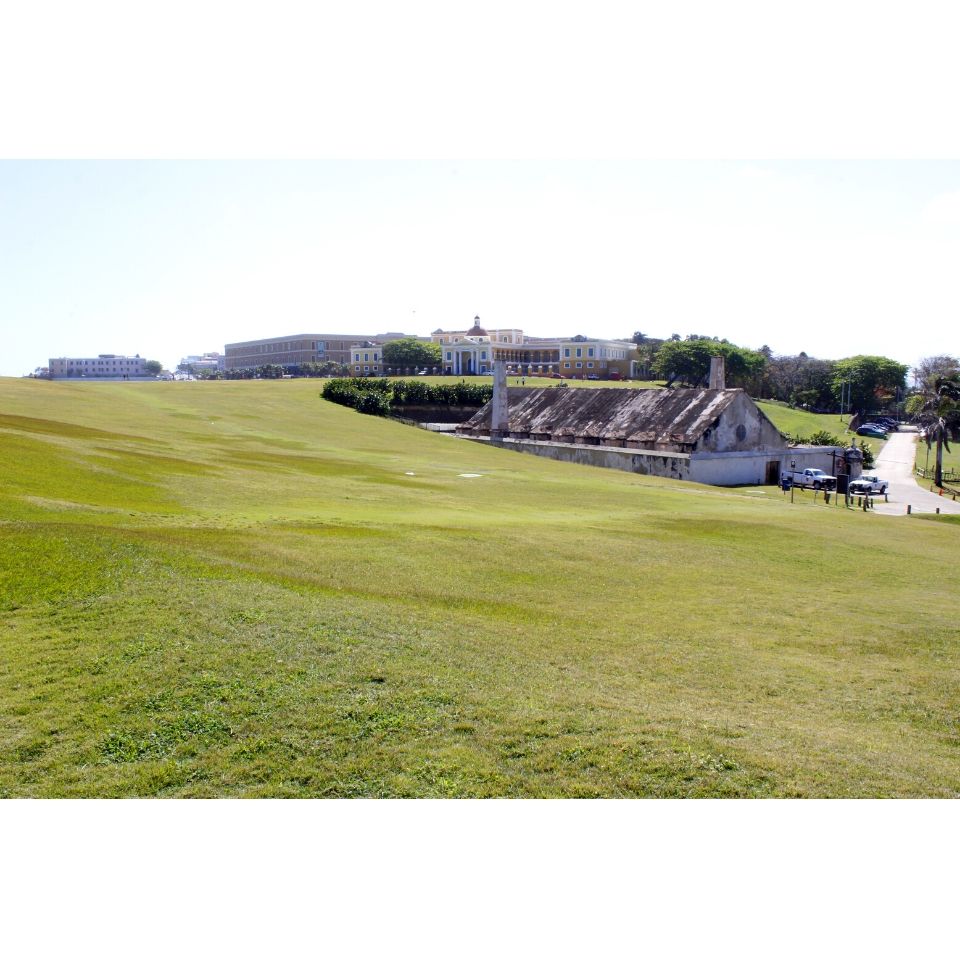 Groups of soldiers gathered on a large grassy field