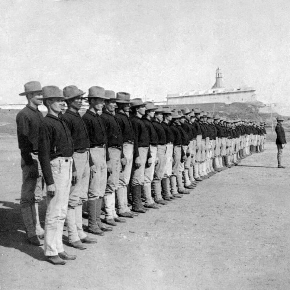 Men in uniform standing in two rows