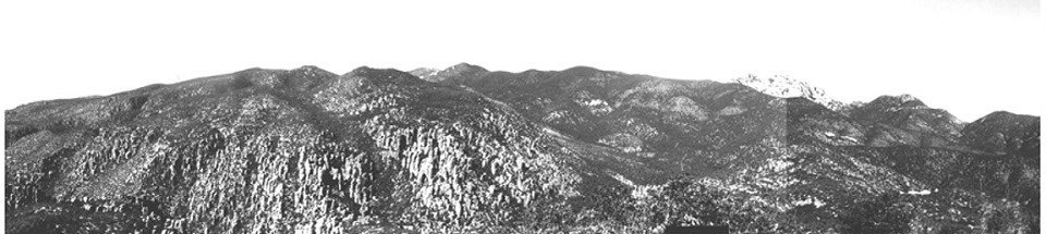 Black and white photo of a rocky mountain range
