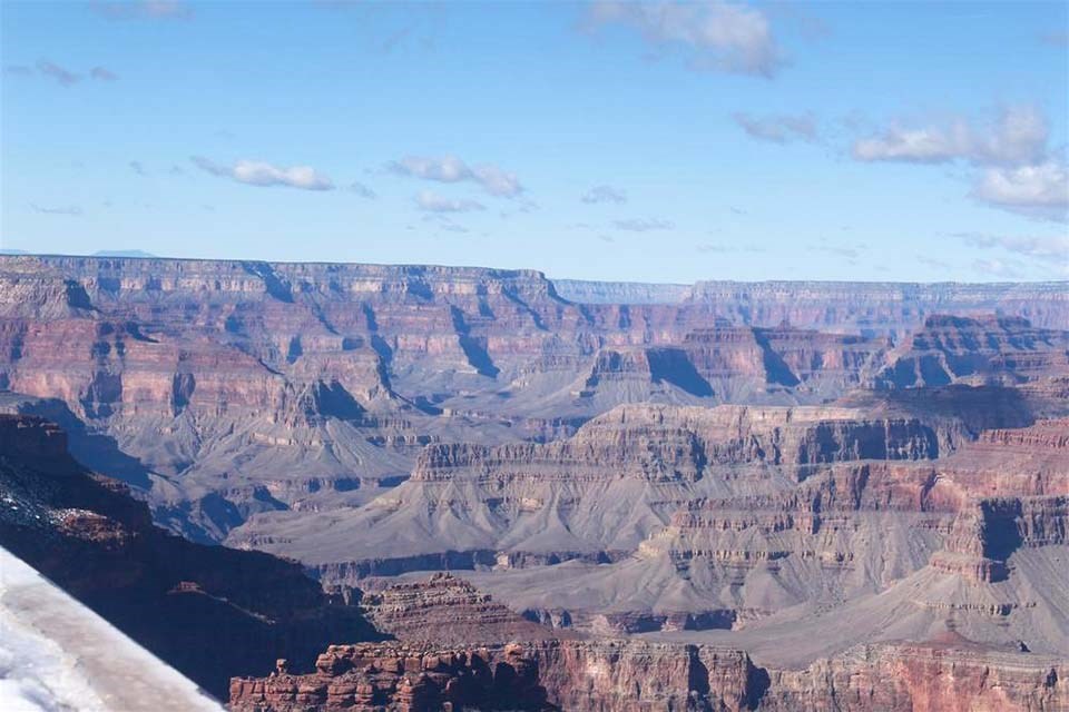 Webcam view on a clear day showing peaks, ridgelines and cliffs within a mile deep canyon landscape