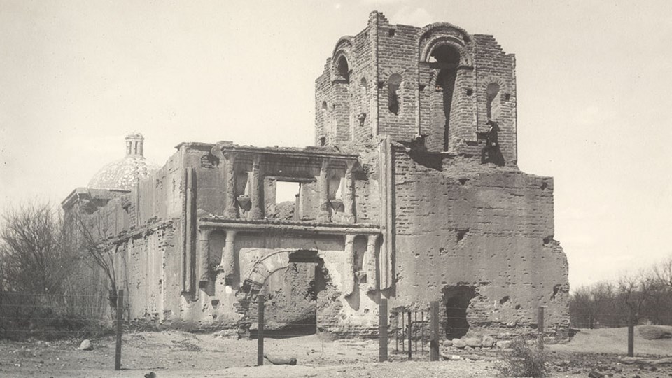 historic photo of mission church with pediment and roof missing