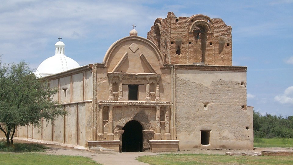 historic photo of mission church with pediment and roof missing