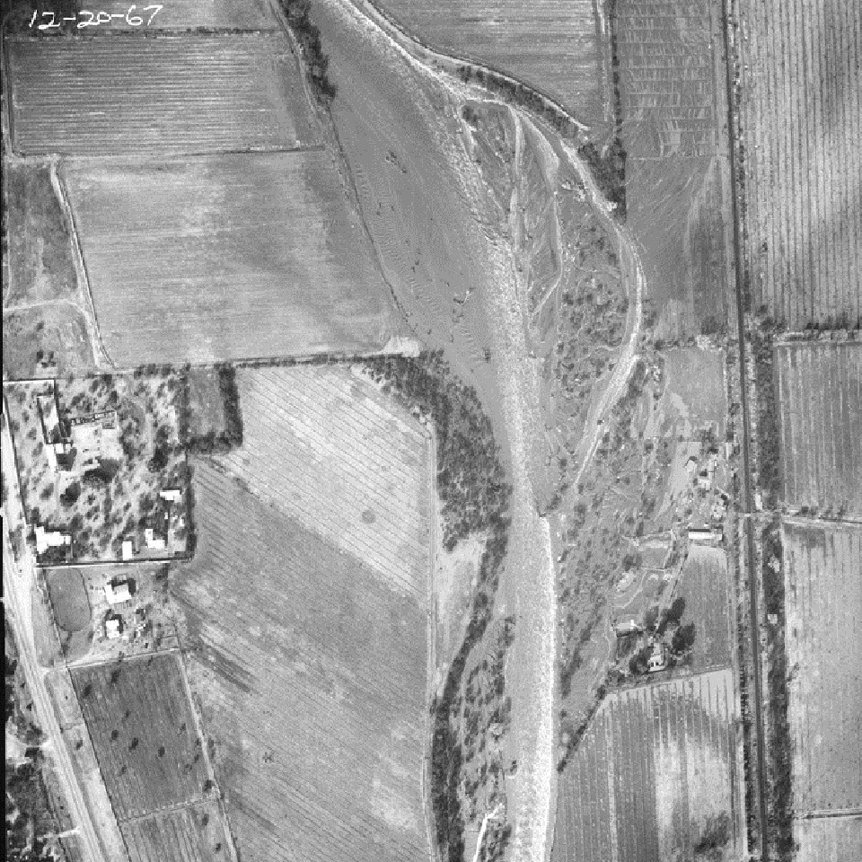 black and white aerial photo of mission grounds and farm fields to the east
