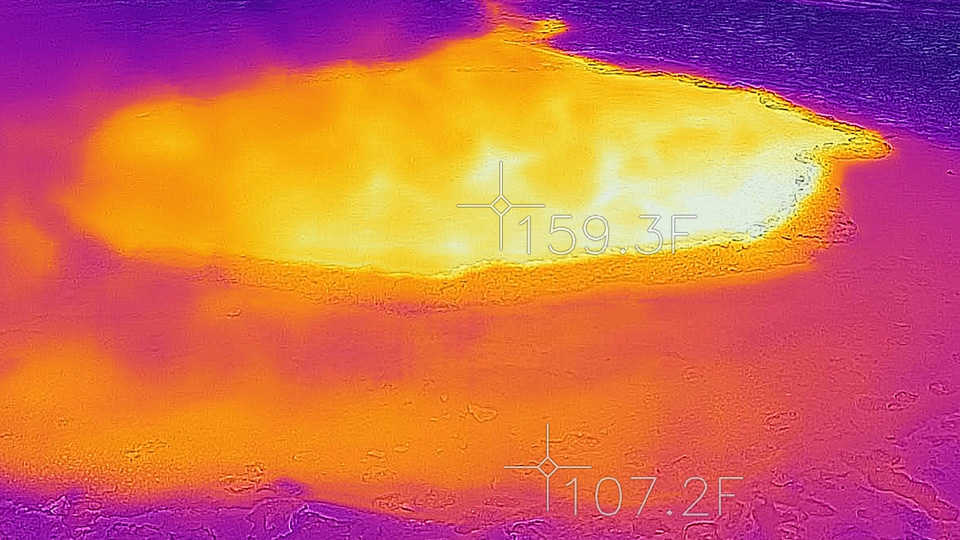 Infrared scene shows the hot water of the hot spring (in yellow) in contrast the the surrounding cool landscape (in blue)