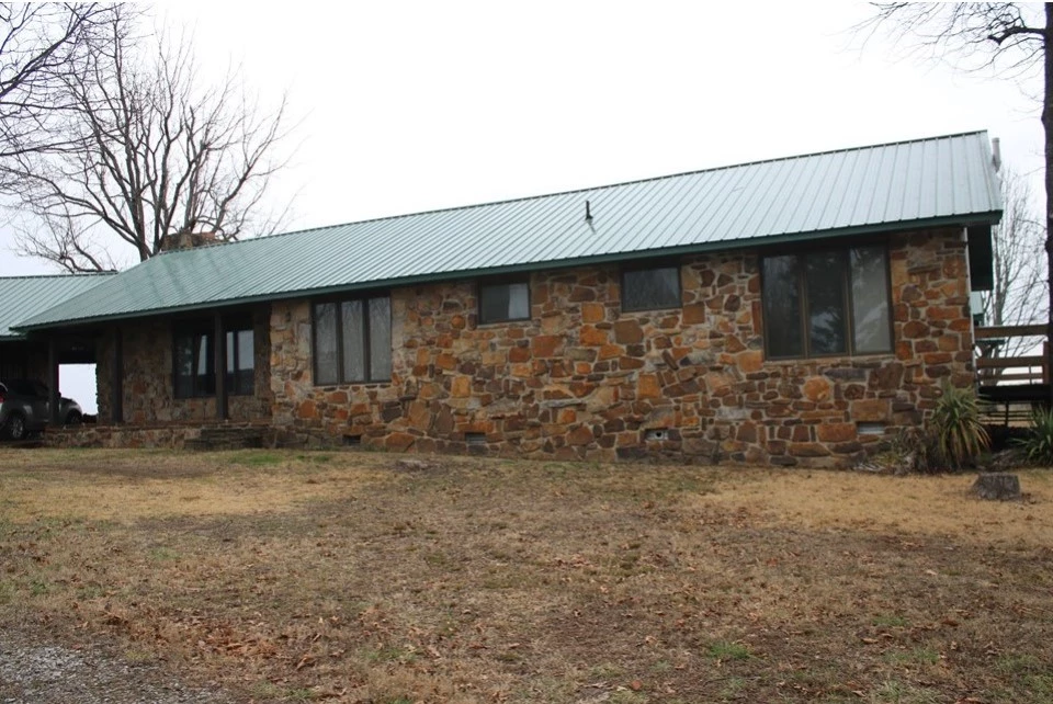 A tan house made of stone.