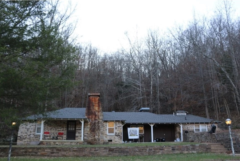 A tan house made of stone.