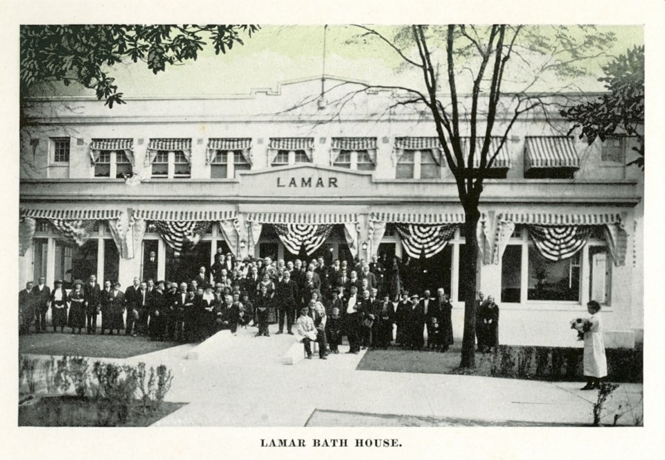 Historic photo of the Lamar from its grand opening in the early 1900s. A group of men pose for the picture.