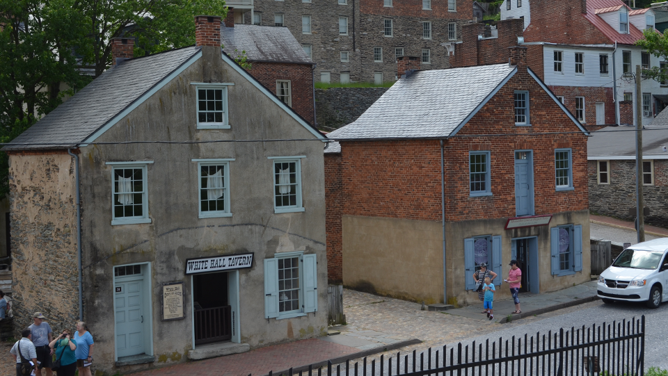 black and white photo of two buildings in need of repair