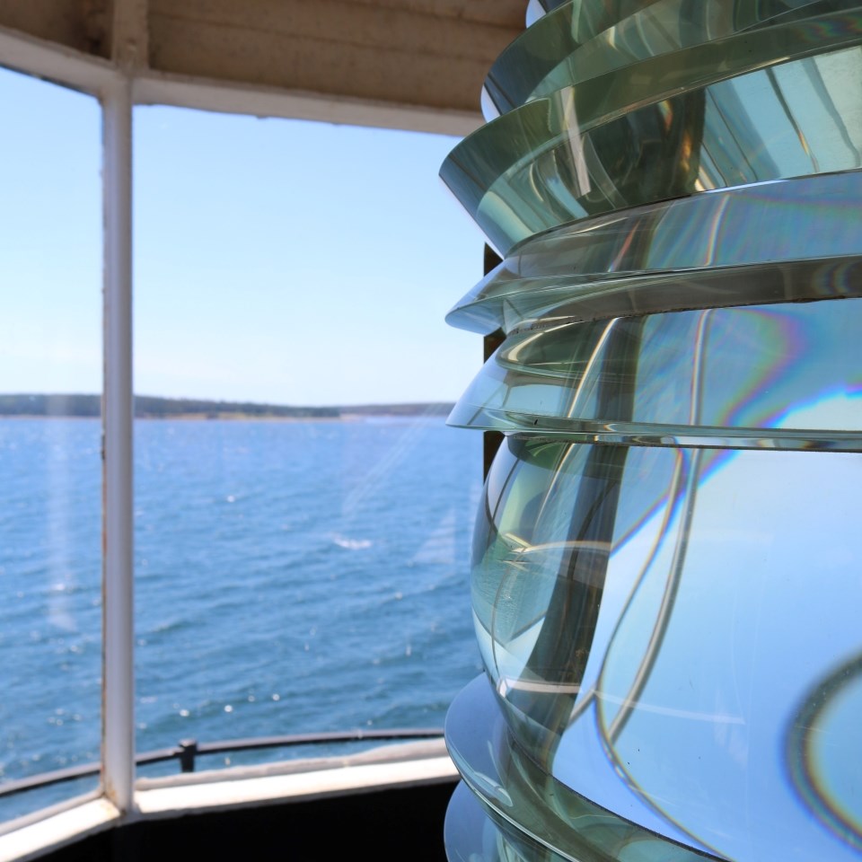 Lighthouse tower with red cone around light