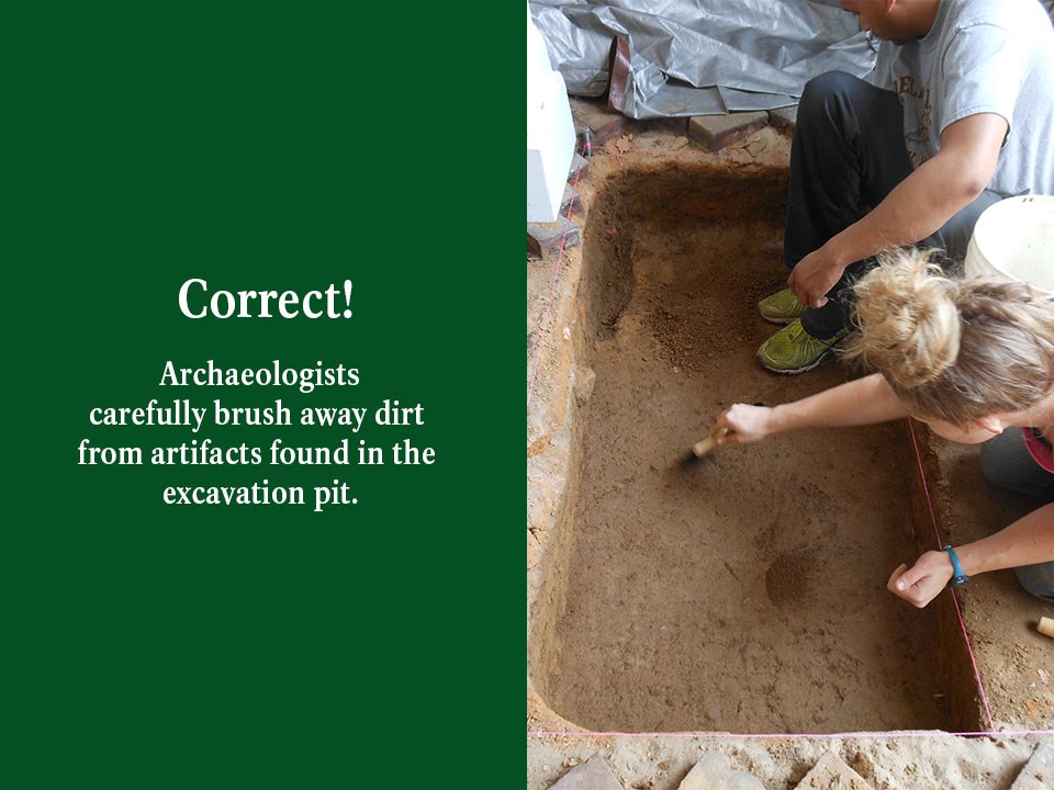 Using string, Archaeologists mark the area where they will remove bricks and layers of dirt prior to excavation.