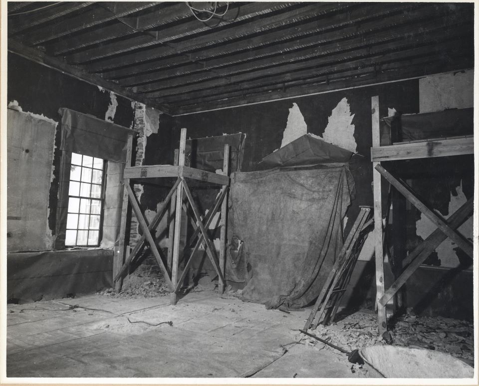 Black and white photo of supports and plaster removed as the drawing room gets restored