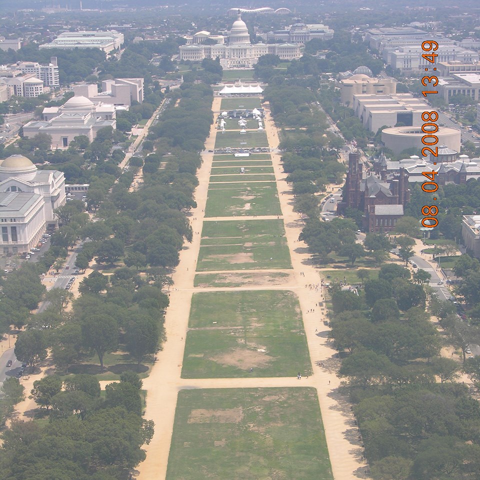 Green national turf with US Capitol in distance