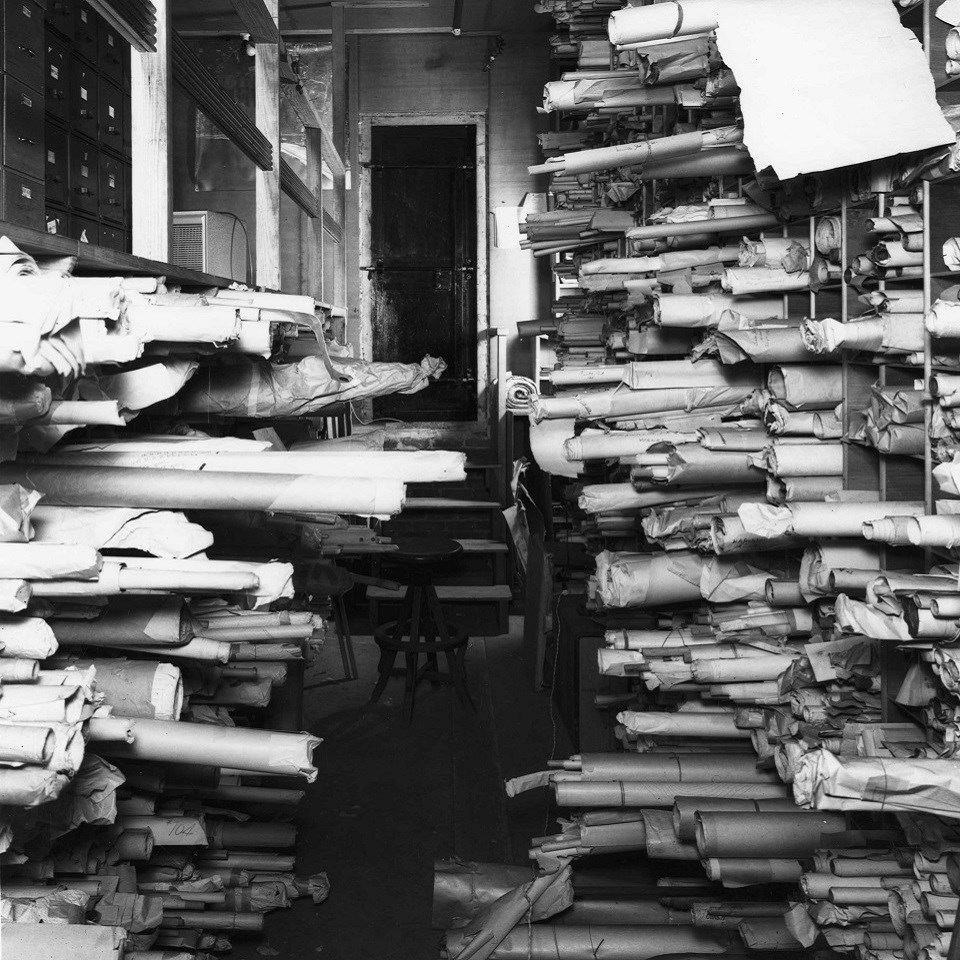 Vault with scrolls of paper in untidy stacks