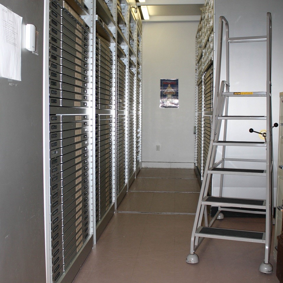 Vault with scrolls of paper in untidy stacks