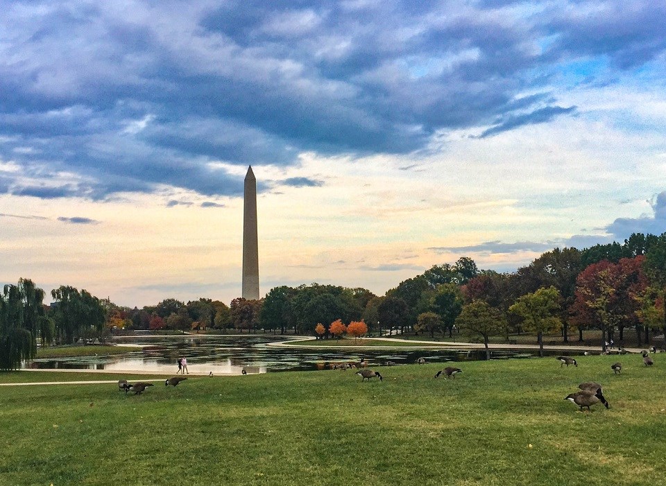 Washington Monument behind a snow-covered lake