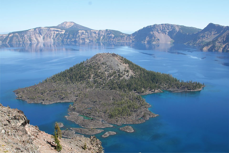 mountain top lake with volcanic cone island with labels