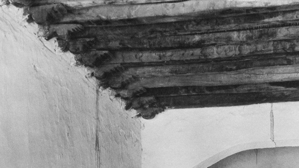 historic photo of roof beams with carved corbels