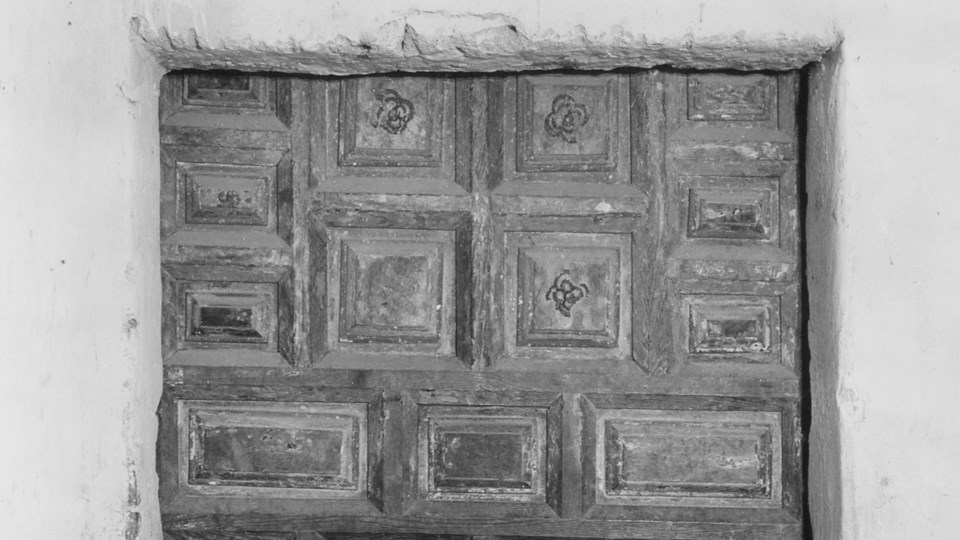 historic photo of door with raised panels