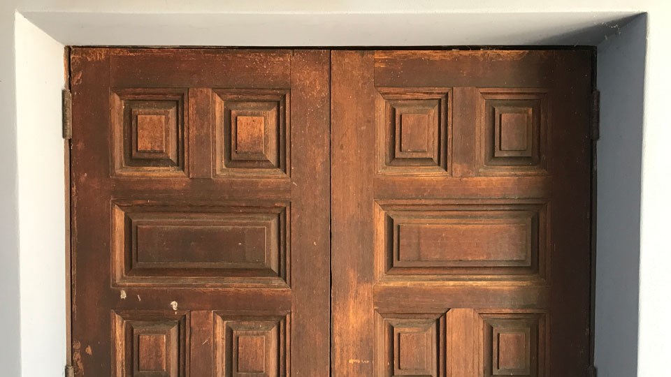 historic photo of door with raised panels