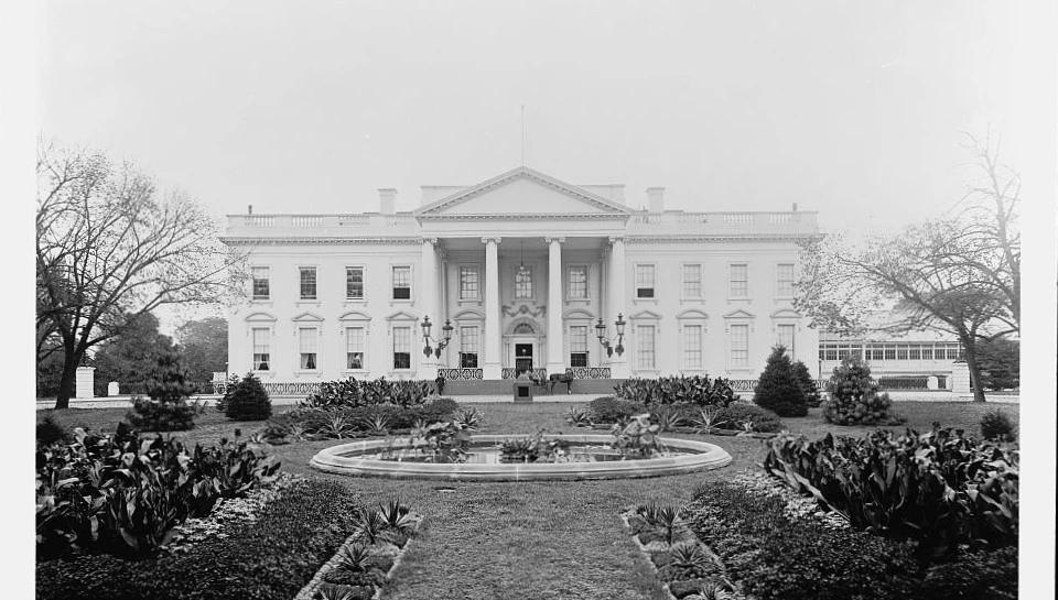 A black and white image of the White House and grounds from the 1890s