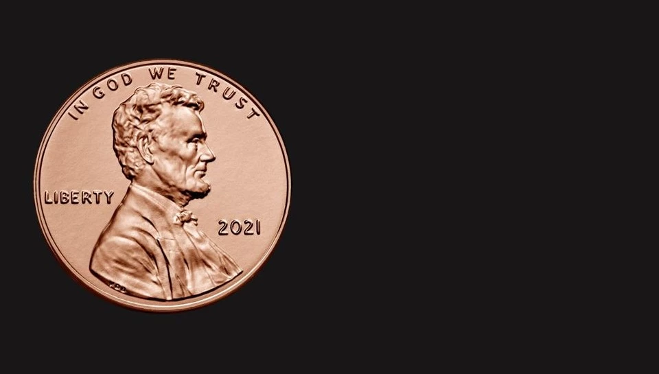 A penny showing Abraham Lincoln's face on the coin