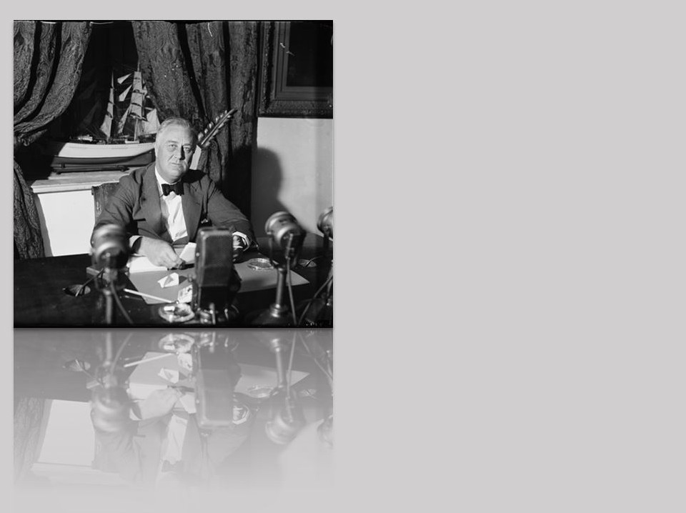 American flag waving in the breeze, the sun shining through the stars