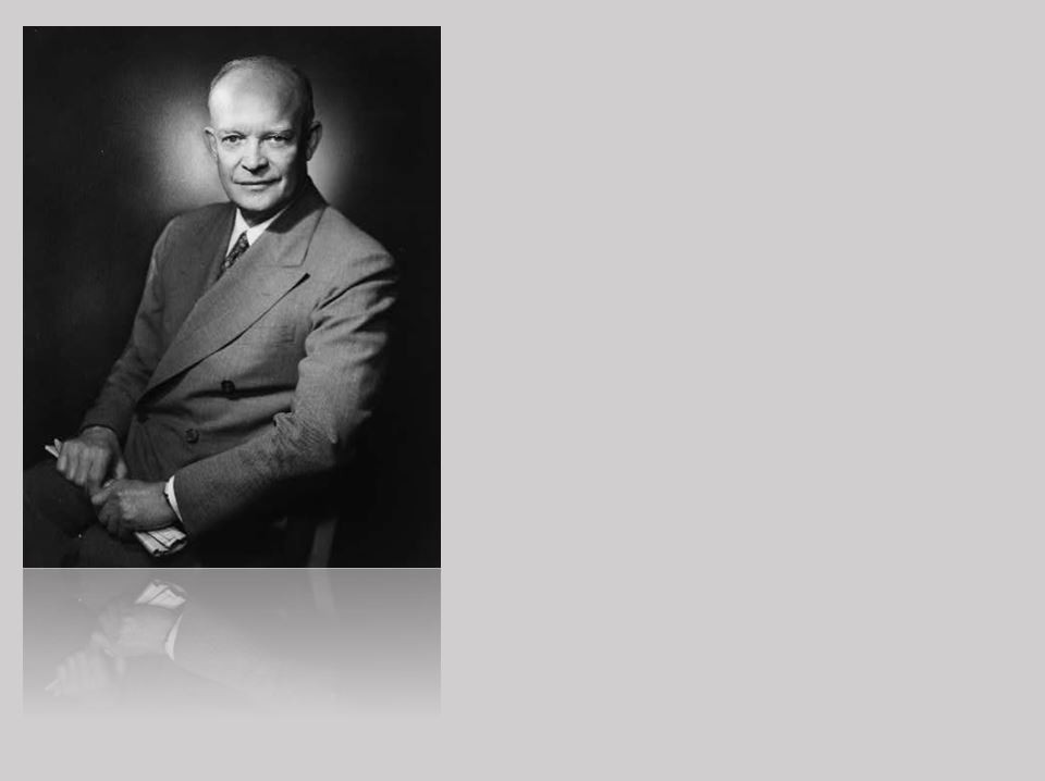 American flag waving in the breeze, the sun shining through the stars