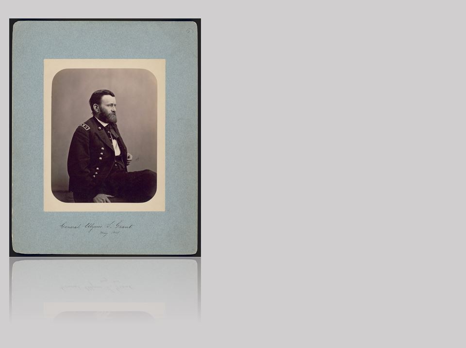 American flag waving in the breeze, the sun shining through the stars