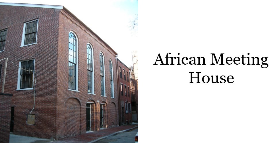 Front of the African Meeting House. First story has two doorways under brick outlined archways. Filled brick archways flank the two doorways. Above are four very tall arched windows spaced evenly over the archways and doorways below.