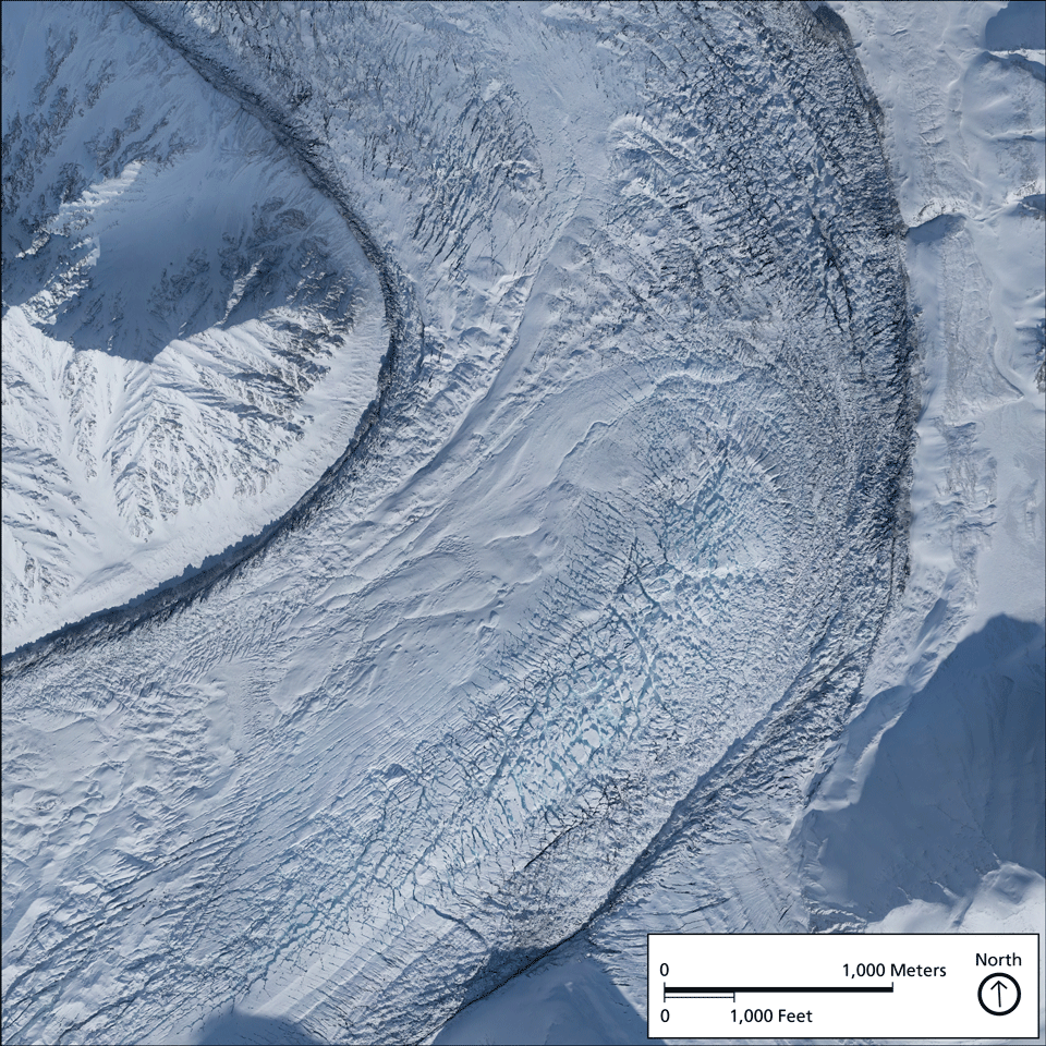 a rock-covered glacier curving around a mountain