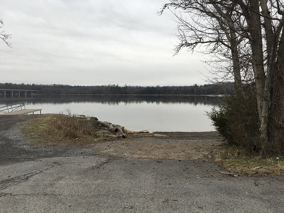 Down a gravel slope to the water.
