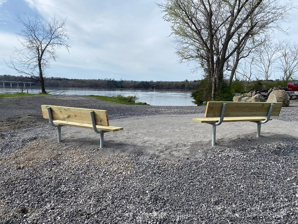 Down a gravel slope to the water.