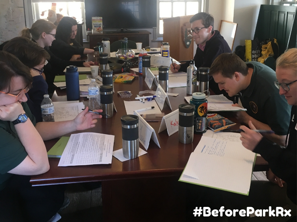 Community Volunteer Ambassadors working at a table