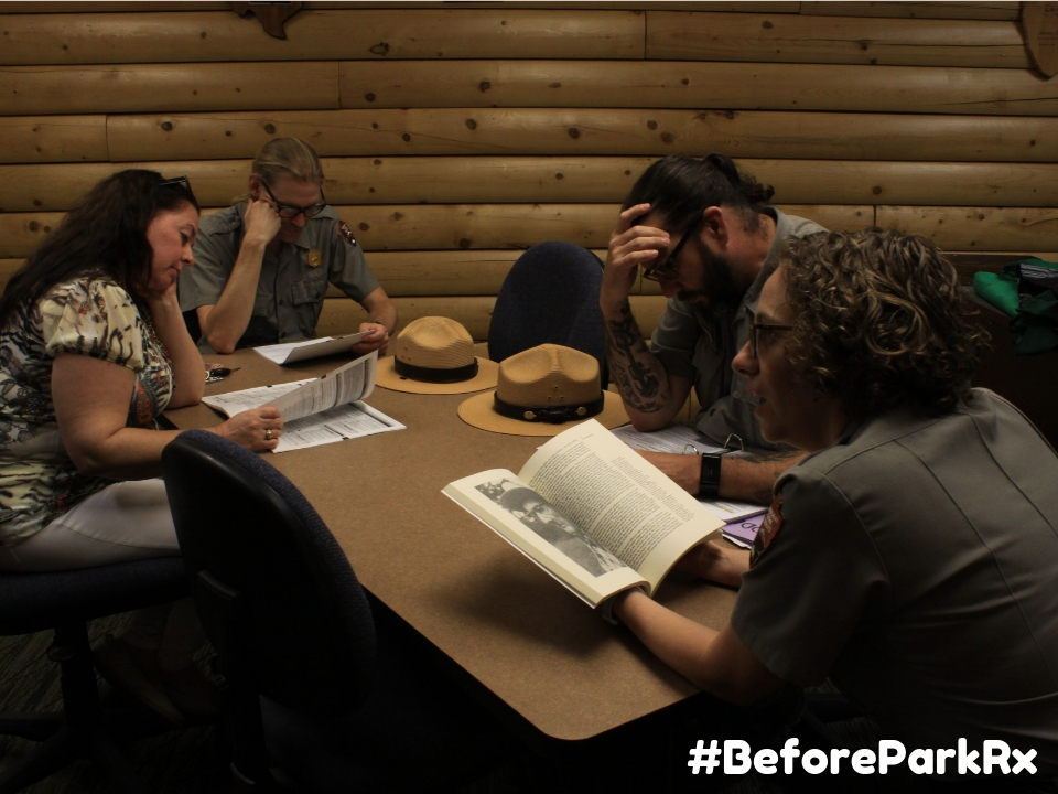 Park Rangers working at table