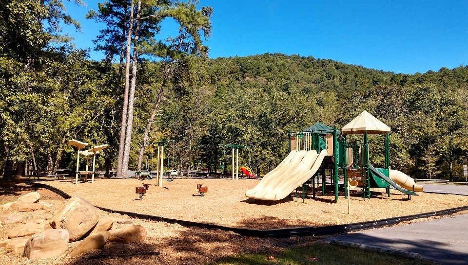 A empty playground with a slide on a sunny day