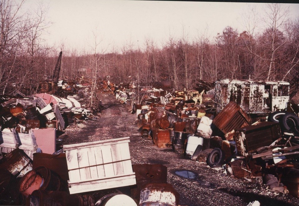 Historic photo of garbage piles in a field