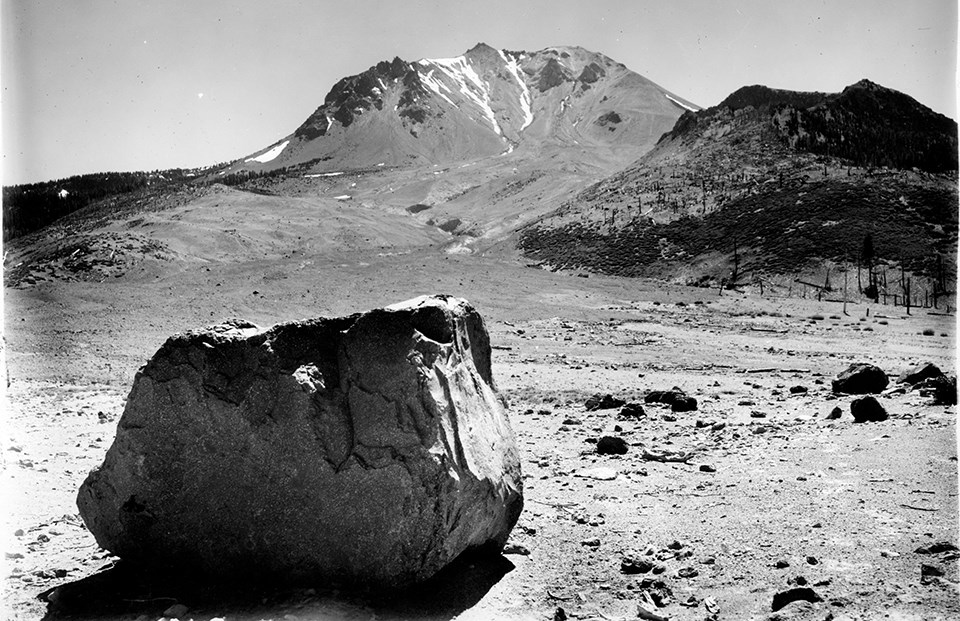 black and white photograph of a recent eruption showing baren slope with peak in the background